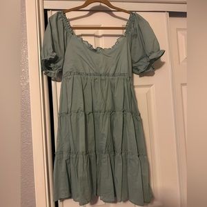 Cute dress that has a lace up back brand new with tags size Xl